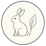 A circular icon featuring a minimalist line drawing of a sitting rabbit next to a single leaf on an off-white background, symbolizing cruelty-free and natural BOTANĒ skincare.